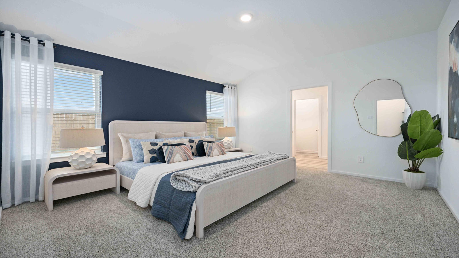 Primary bedroom with two large windows