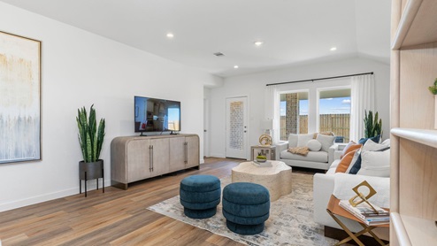 Living room with two large windows and back patio door