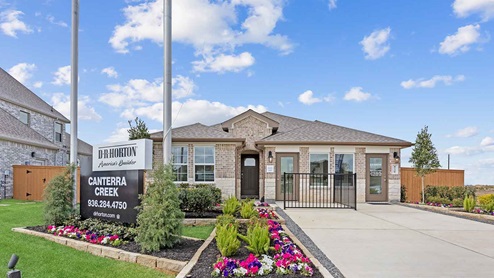 Single story brick home with a two car garage