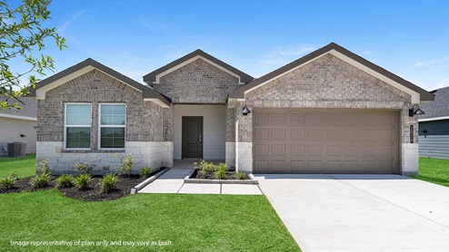 Single story brick home with a two car garage