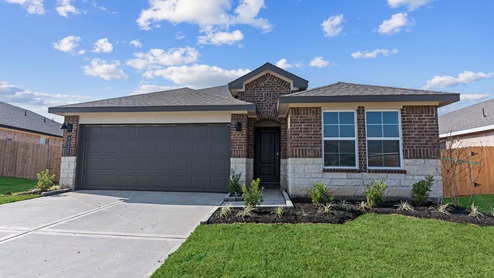 Single story brick home with a two car garage