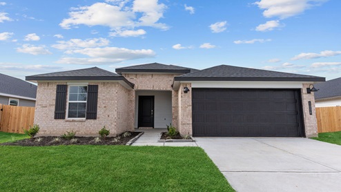 Single story brick home with a two car garage
