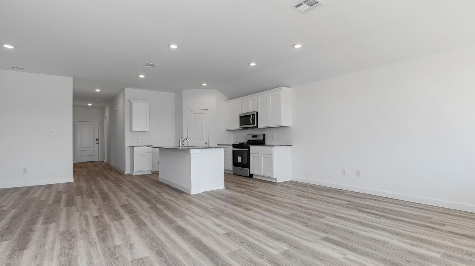 Open concept kitchen, dining, and living room