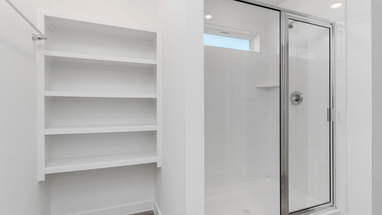 Primary bathroom with open shelving and shower