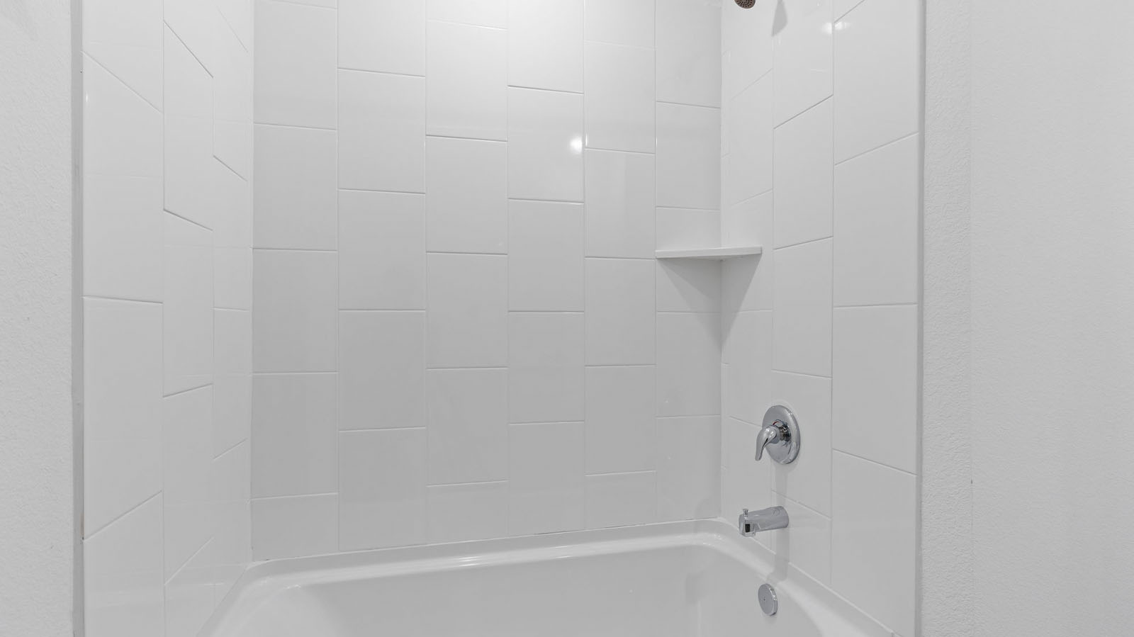 Secondary bathroom with bathtub and shower combo