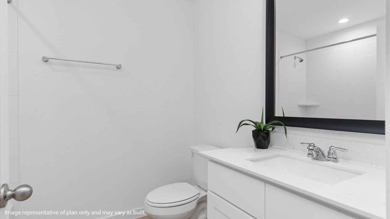 Secondary bathroom vanity with one sink and a large mirror