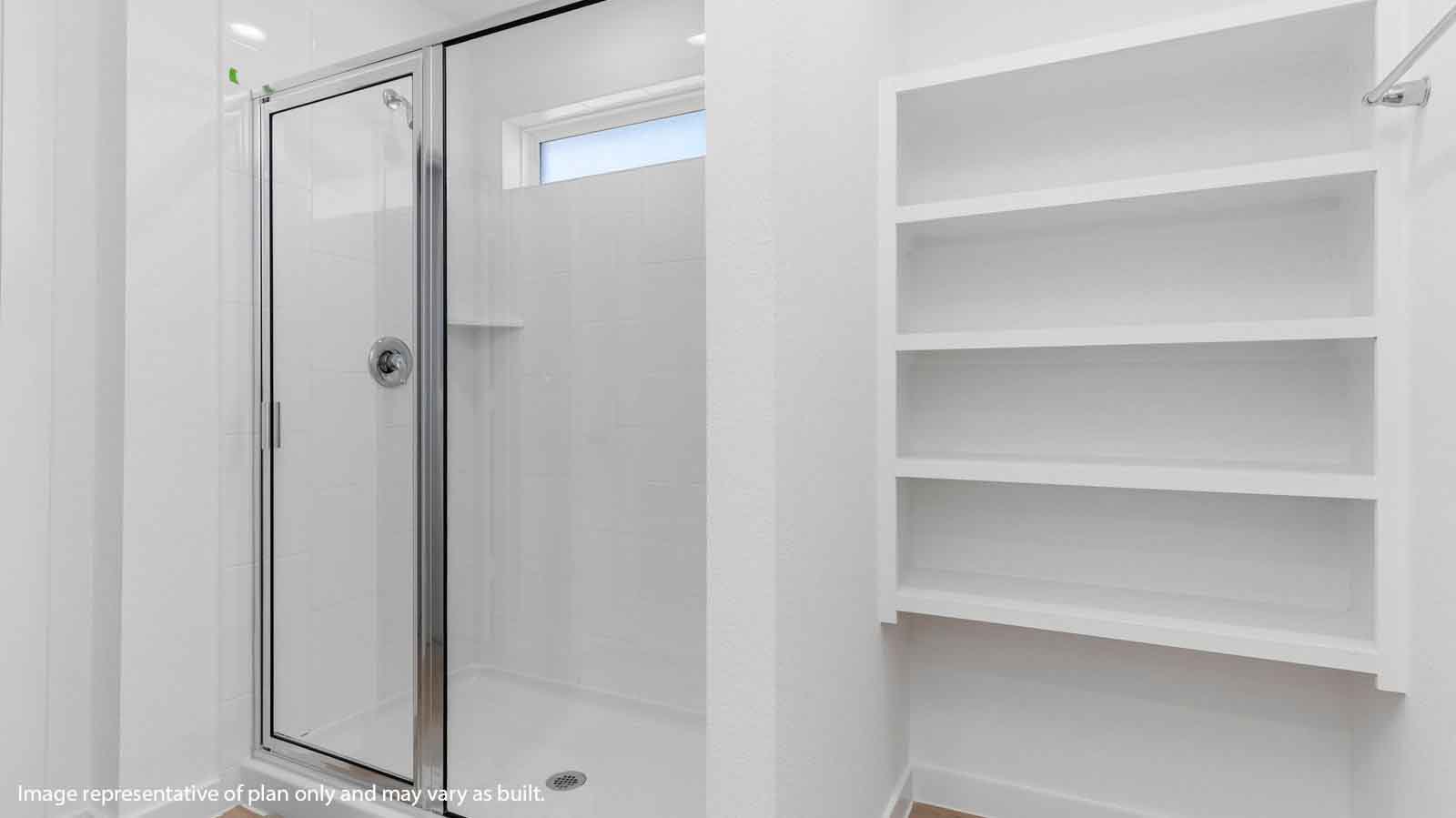 Primary bathroom with open shelving and a glass shower