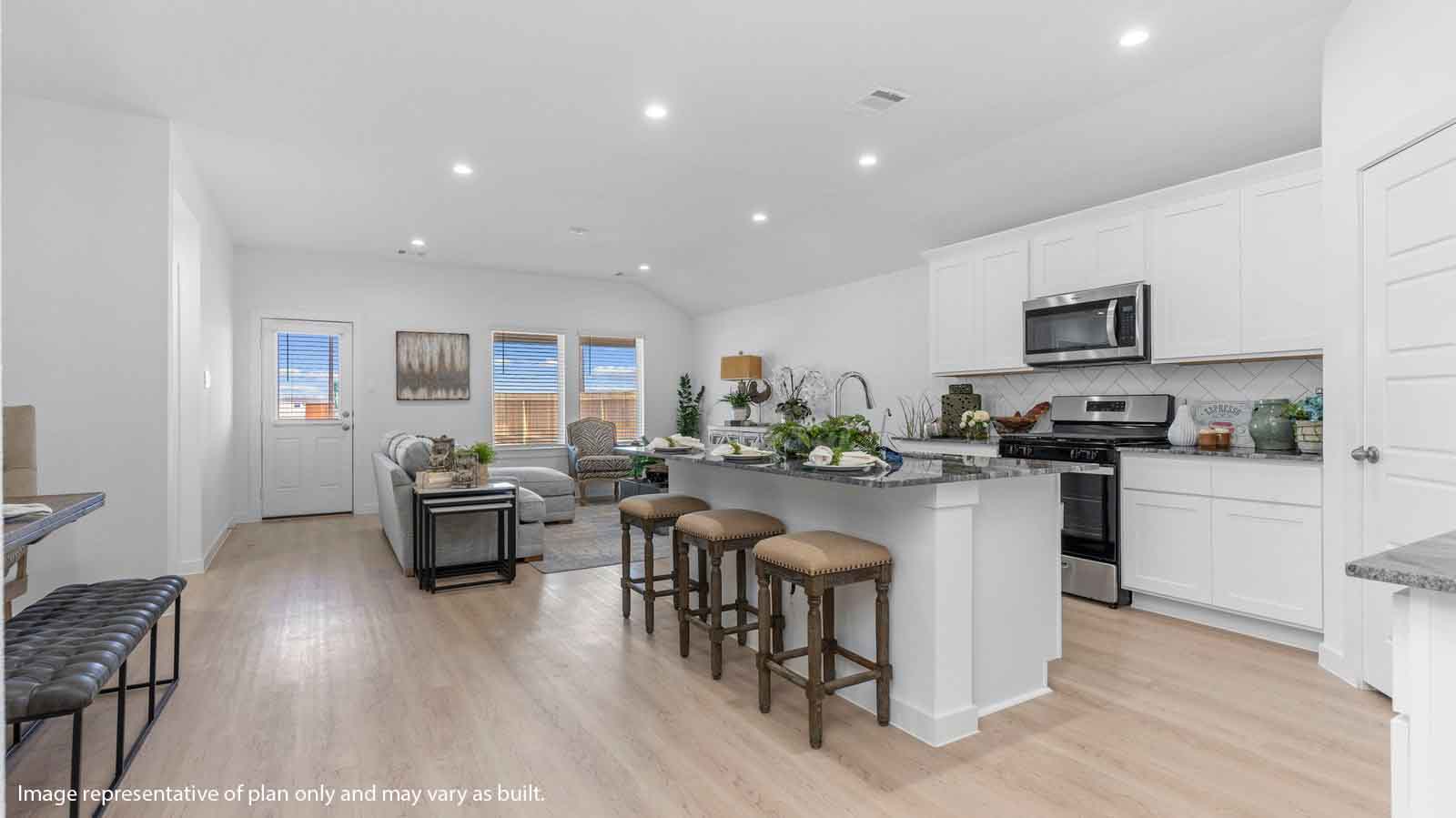 Open concept kitchen, dining and living room