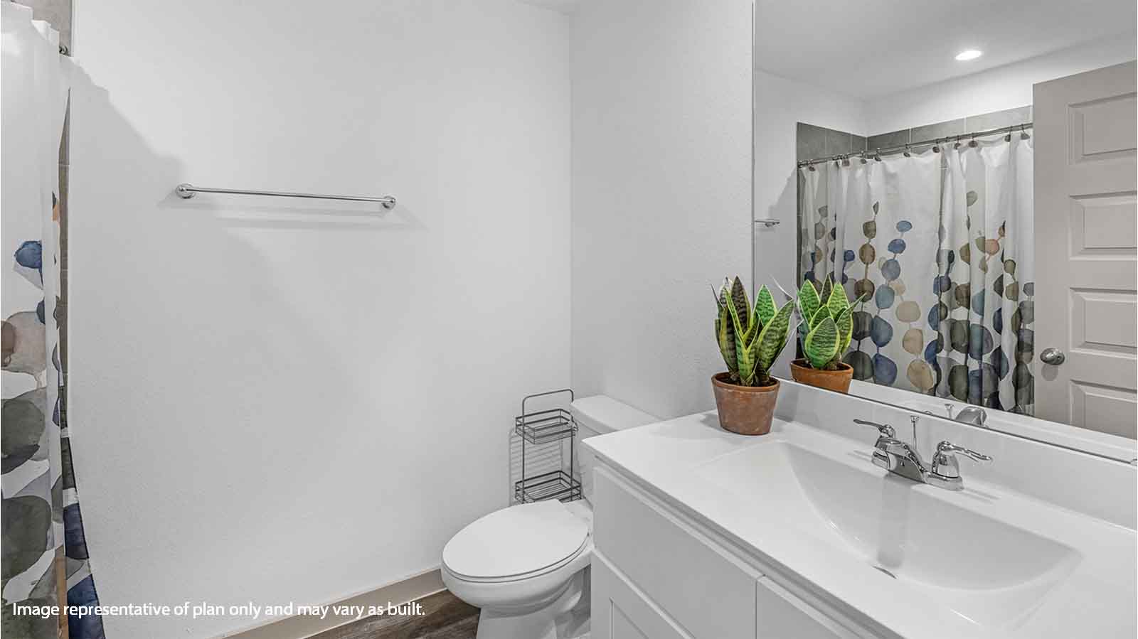 Secondary bathroom vanity with one sink and a large mirror
