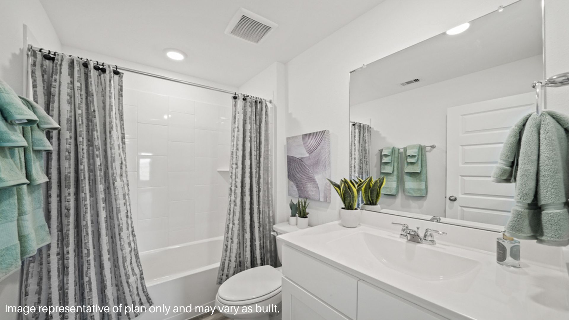 Secondary bathroom vanity with two sinks and a large mirror