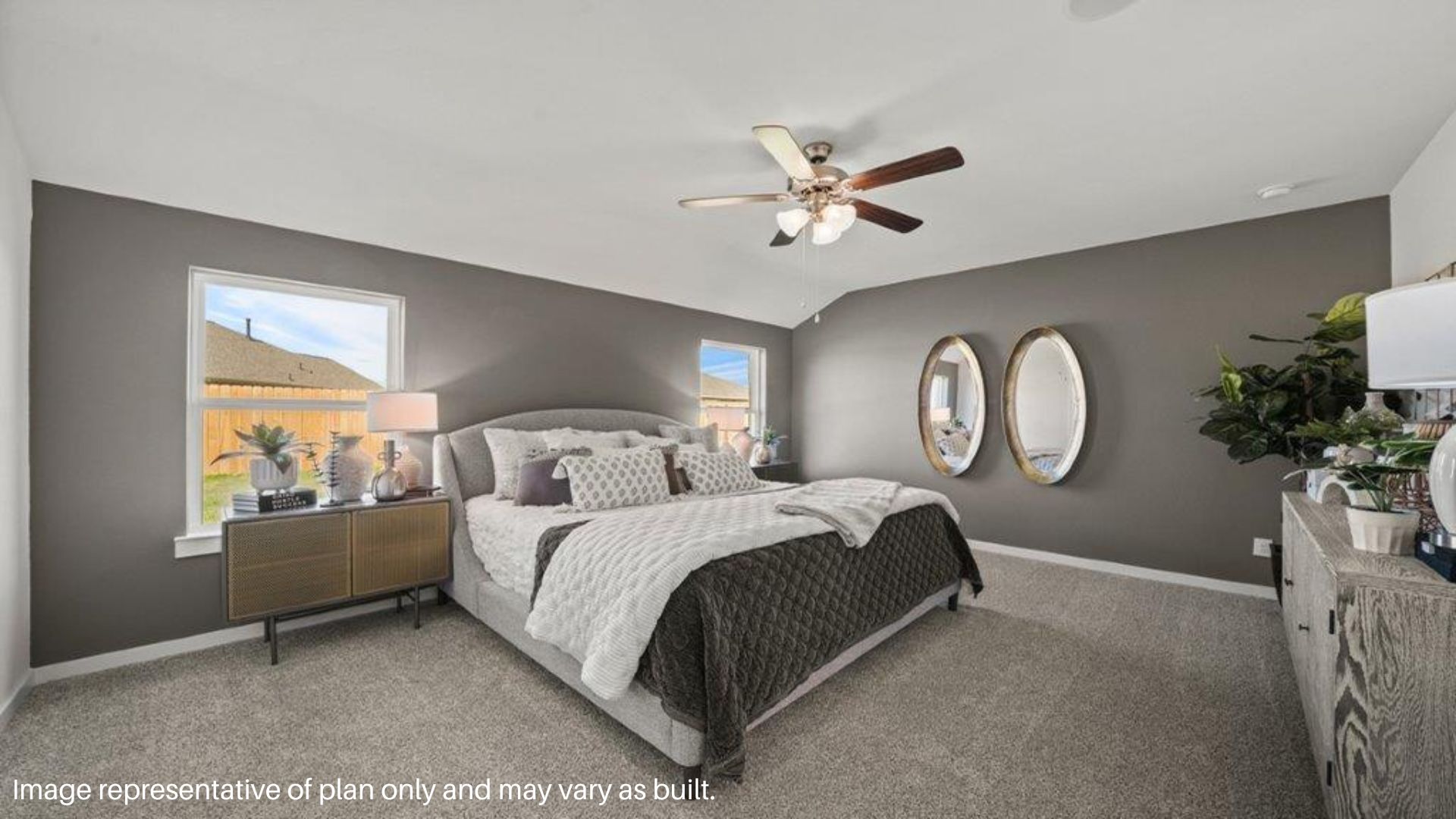 Primary bedroom with two large window