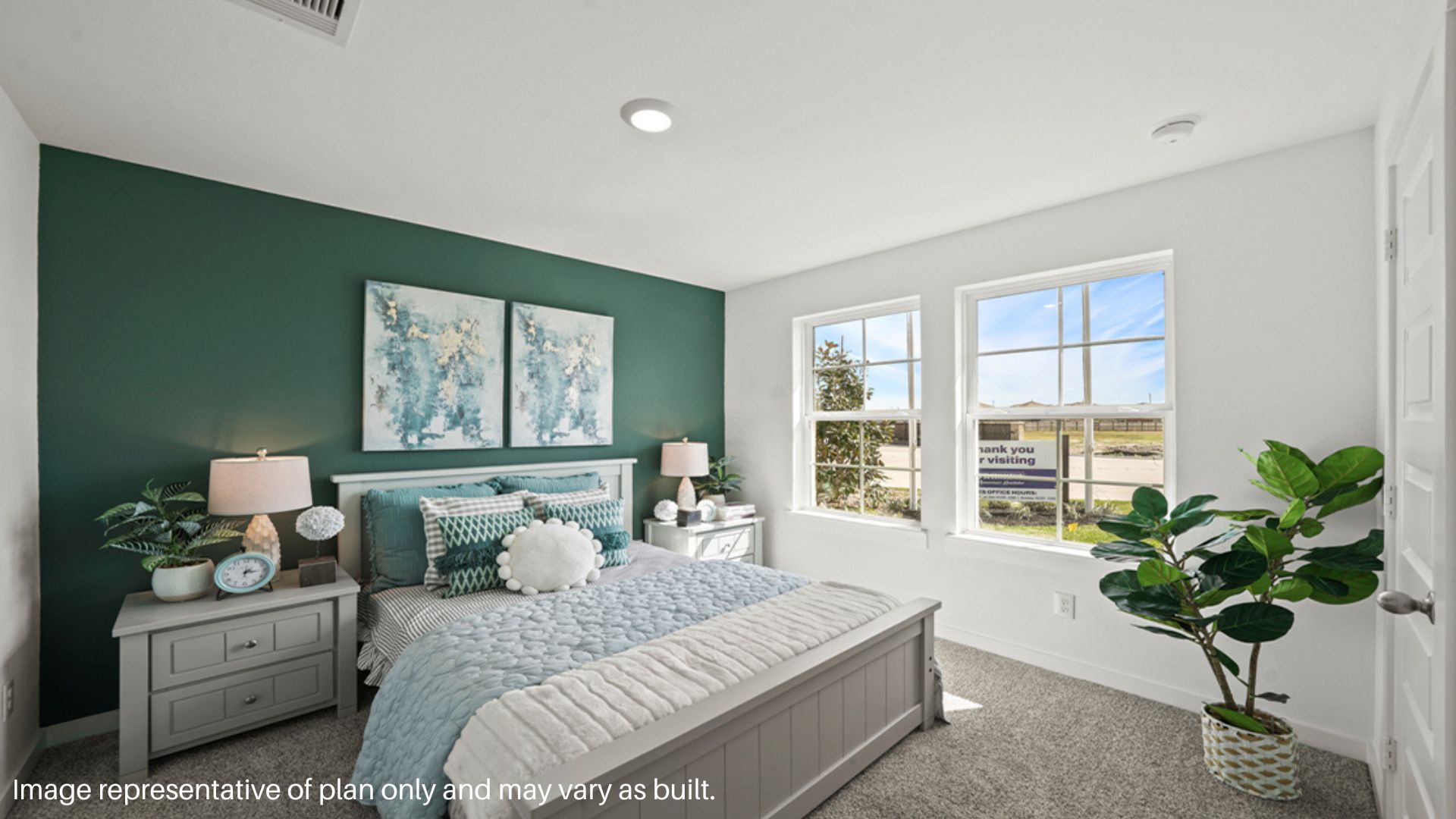 Seconary bedroom with two large windows