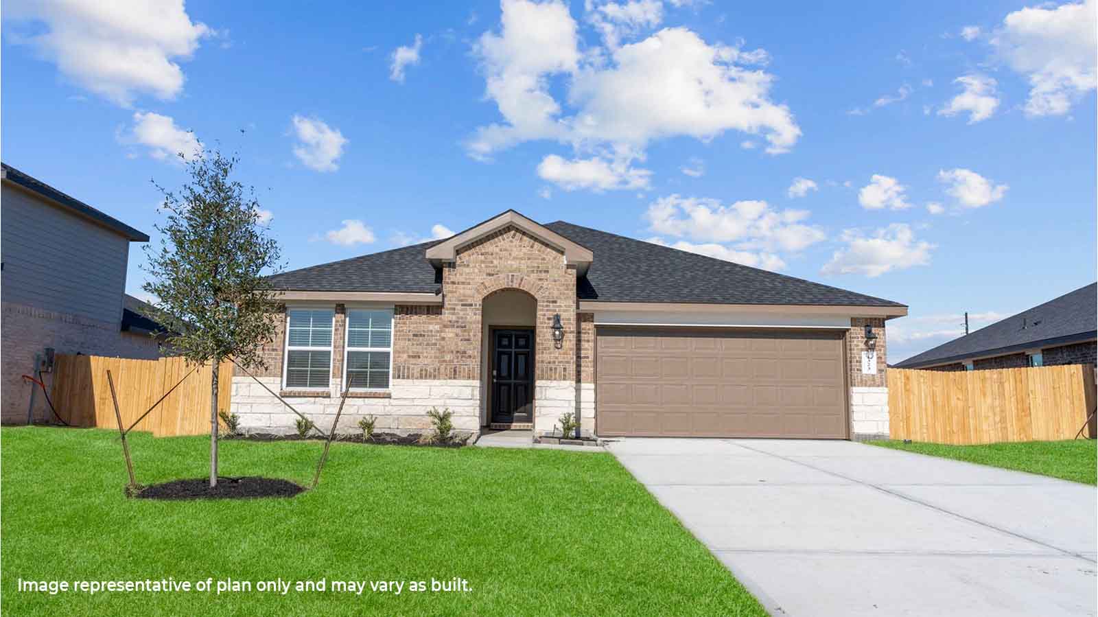 Single story brick home with a two car garage