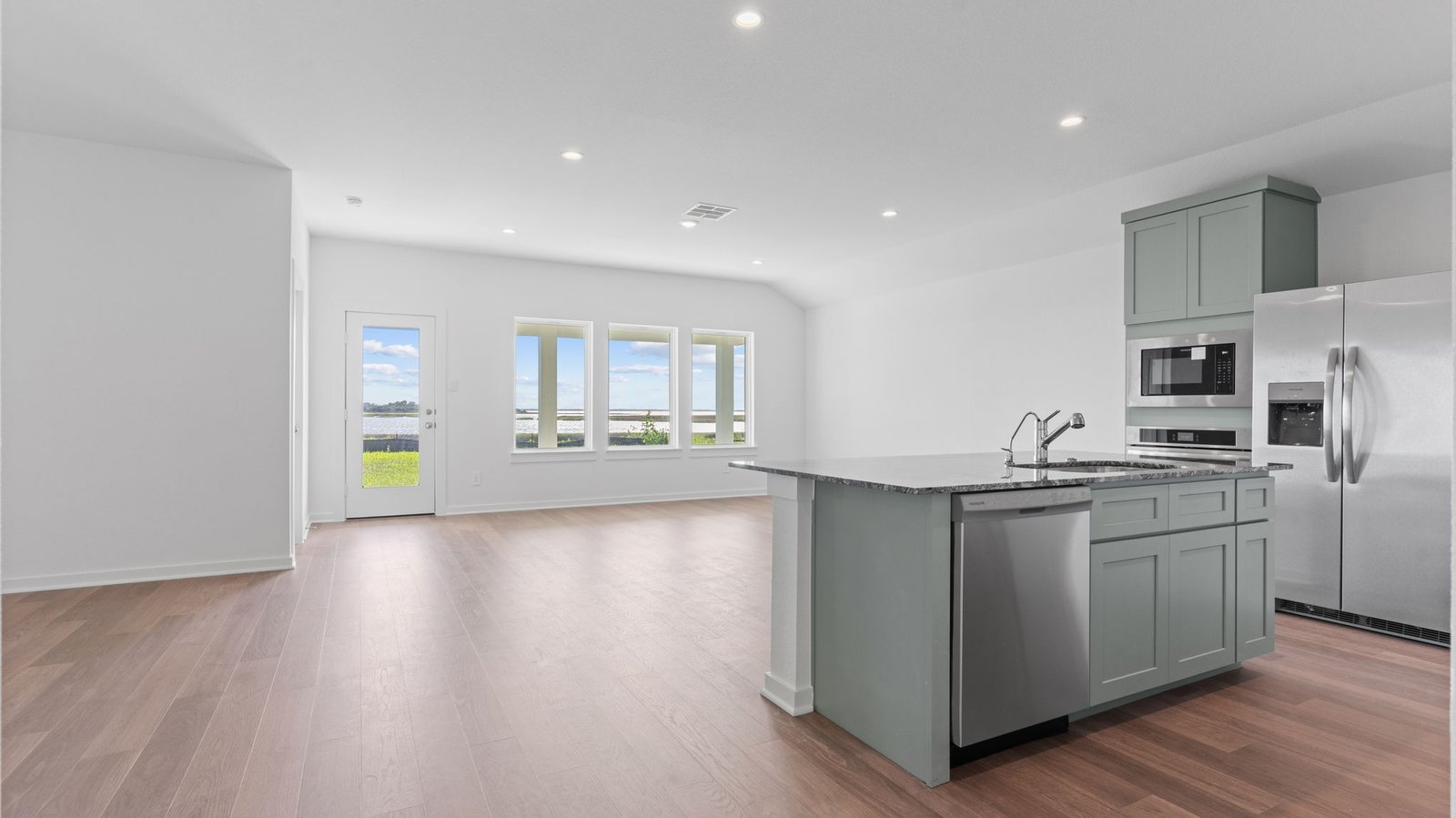 Interior kitchen with center island open to living area