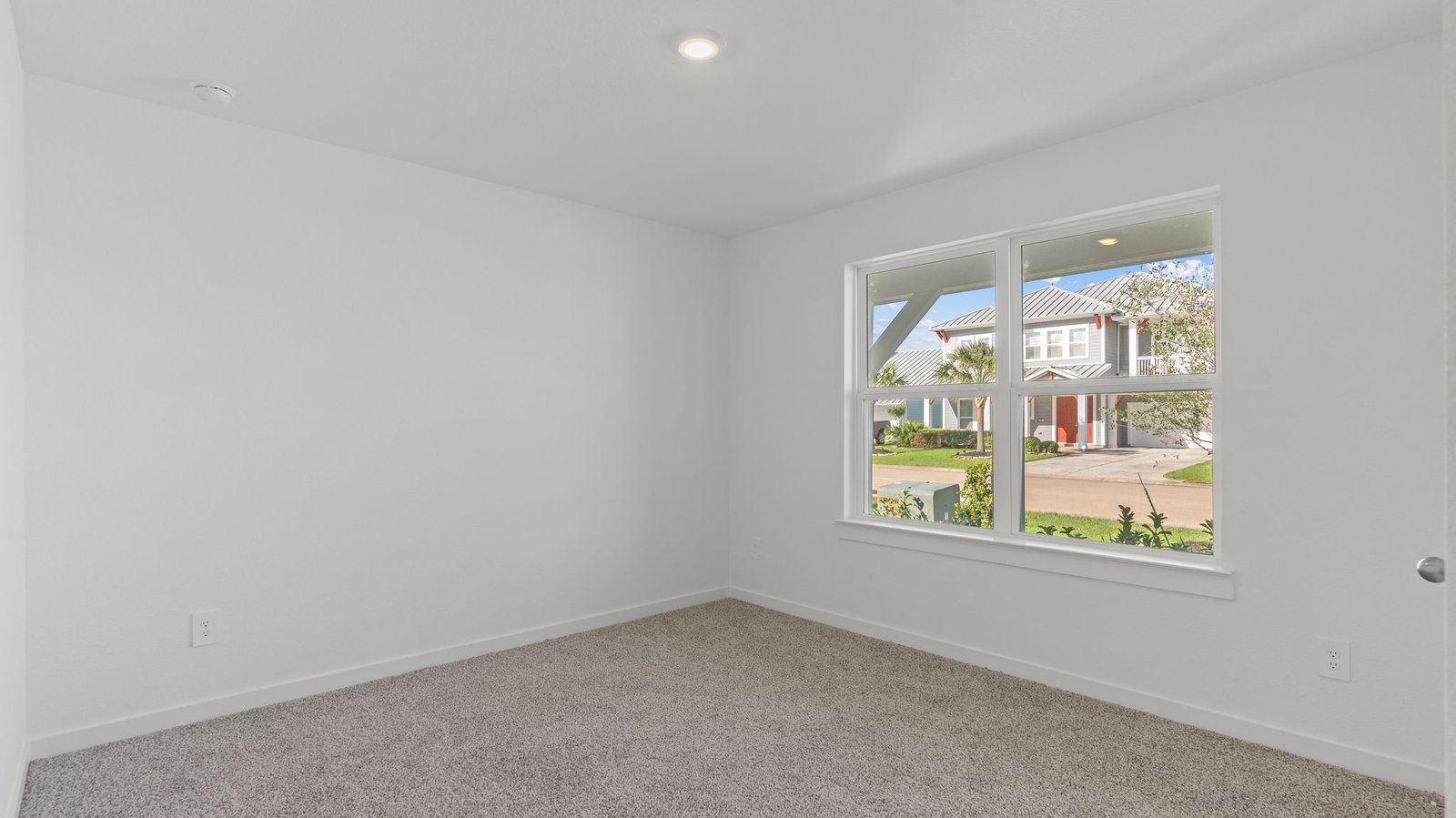 Interior bedroom with large windwo