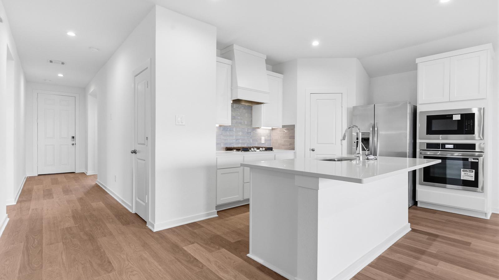kitchen with large island and walk in pantry