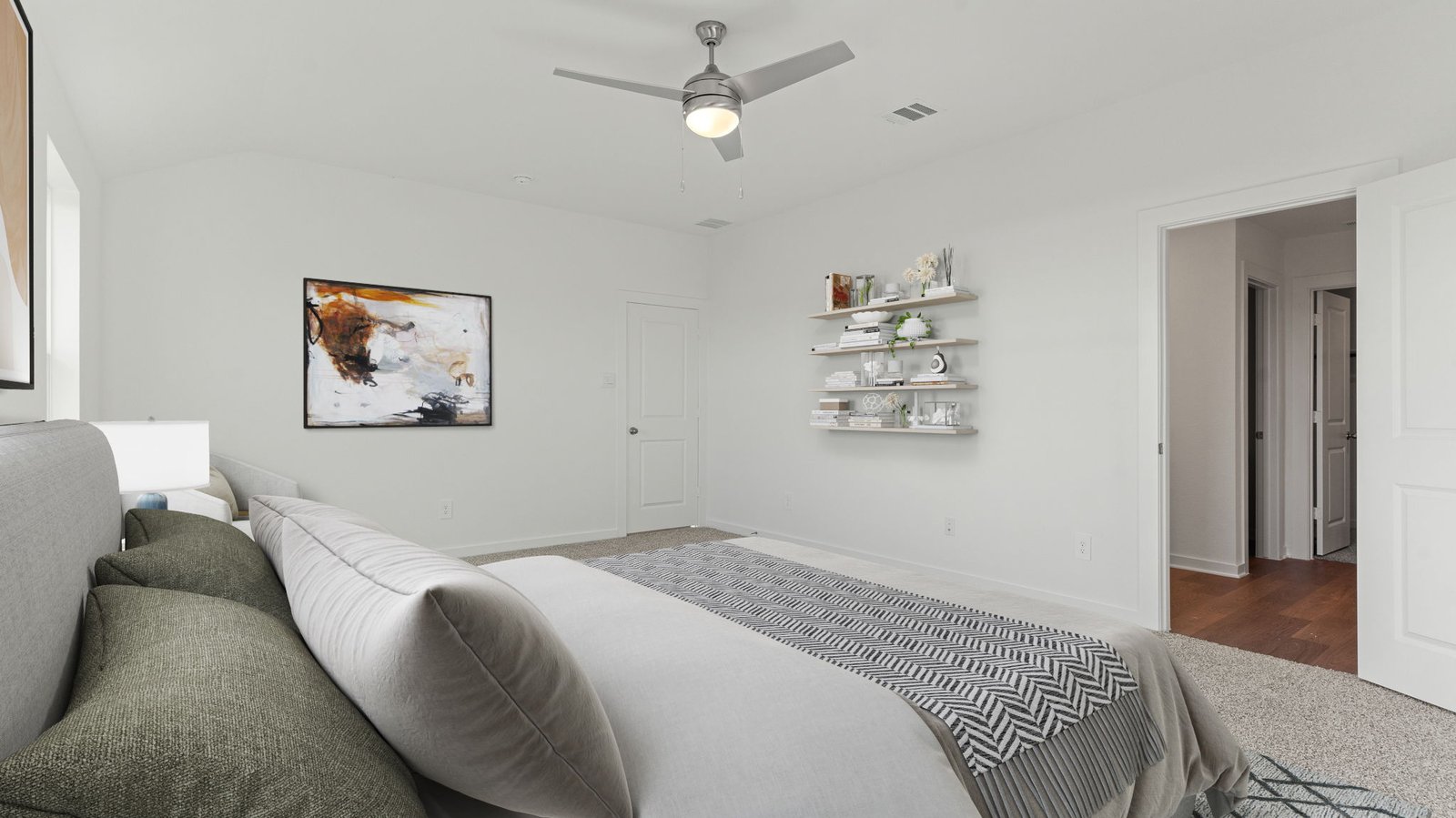 primary bedroom staged with furniture