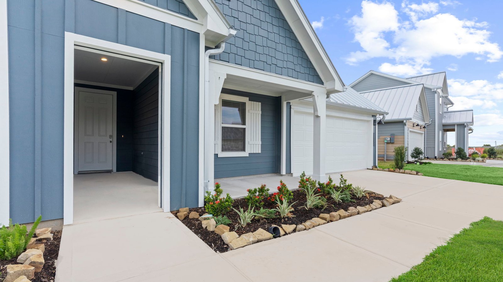 Single story brick home with a two car garage