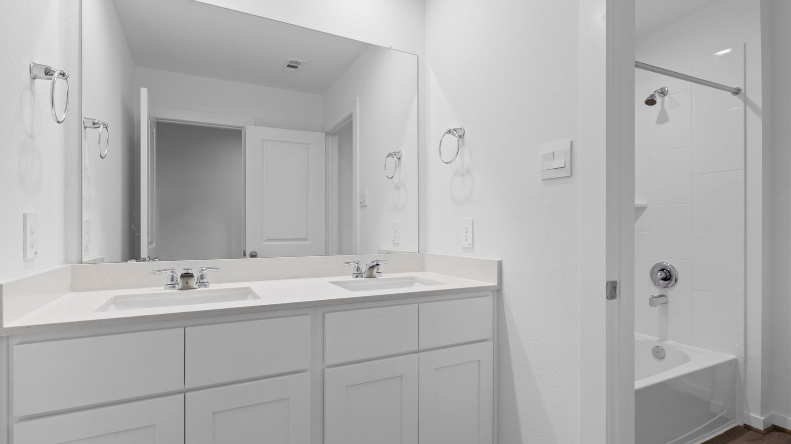 secondary bathroom with two sinks