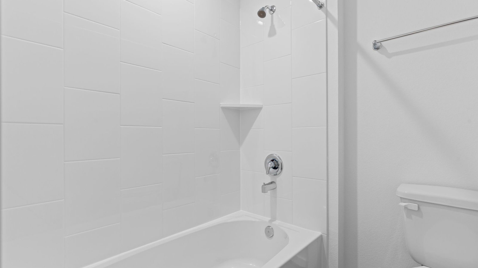 secondary bathroom with bathtub and shower combo