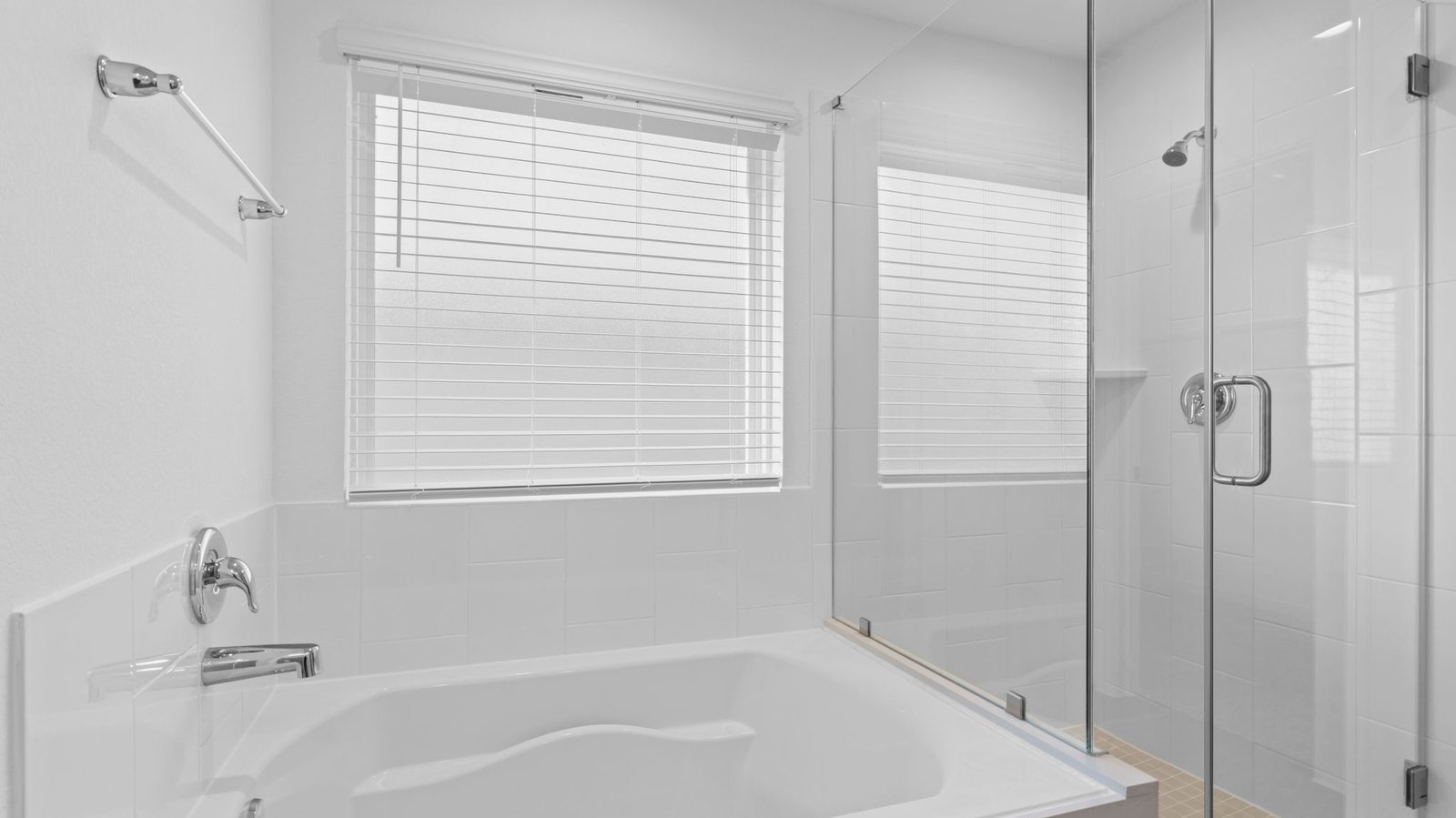 primary bathroom with bathtub and shower