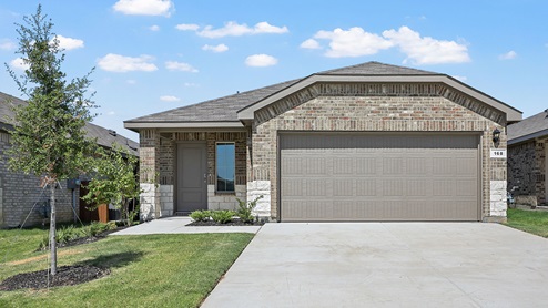 one story brick home with a two car garage