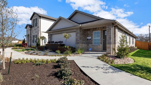 one story brick home with a two car garage