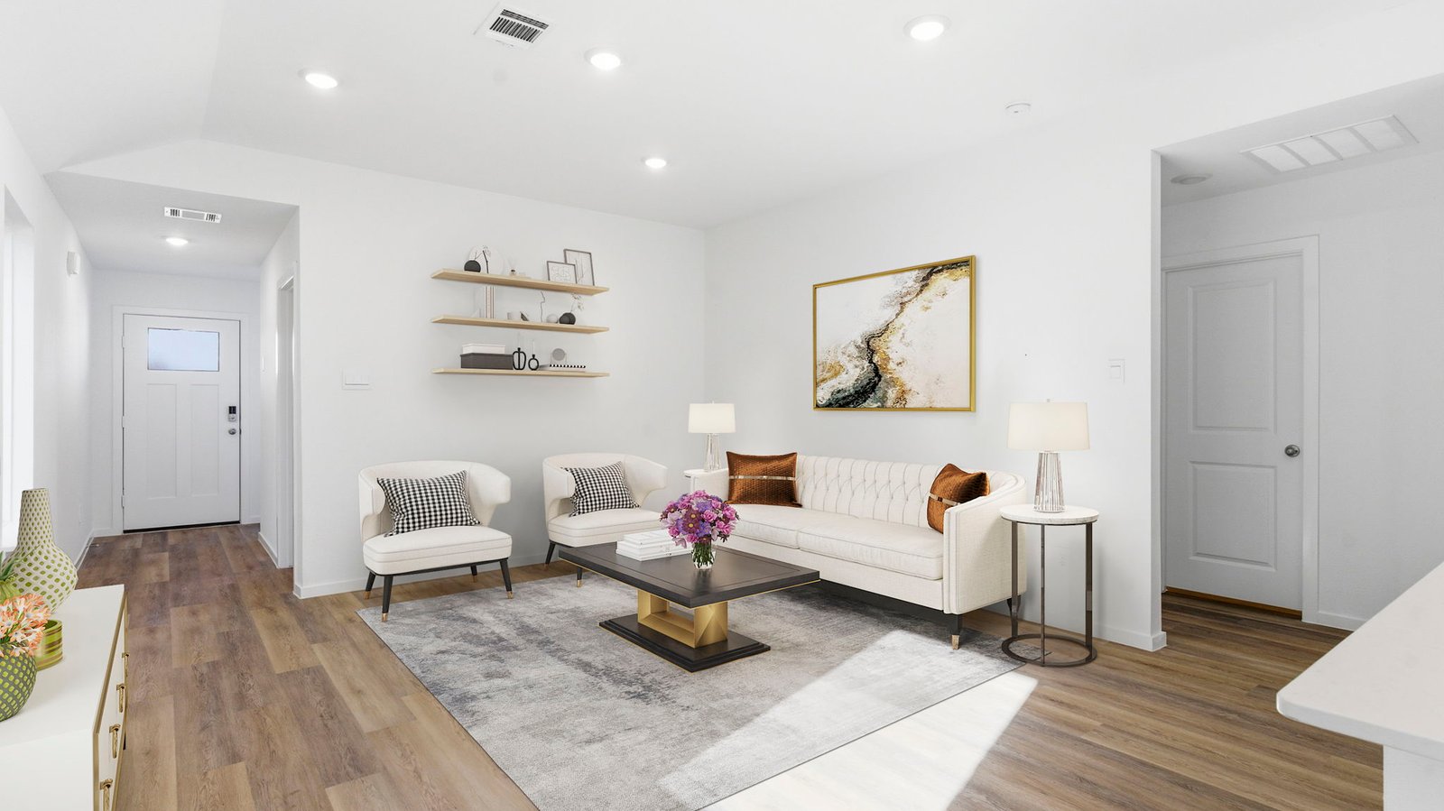 A well-organized living room that includes a kitchen and dining area, creating a warm and welcoming environment for gatherings.