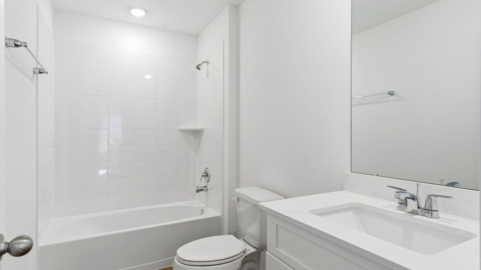 secondary bathroom with tub and shower