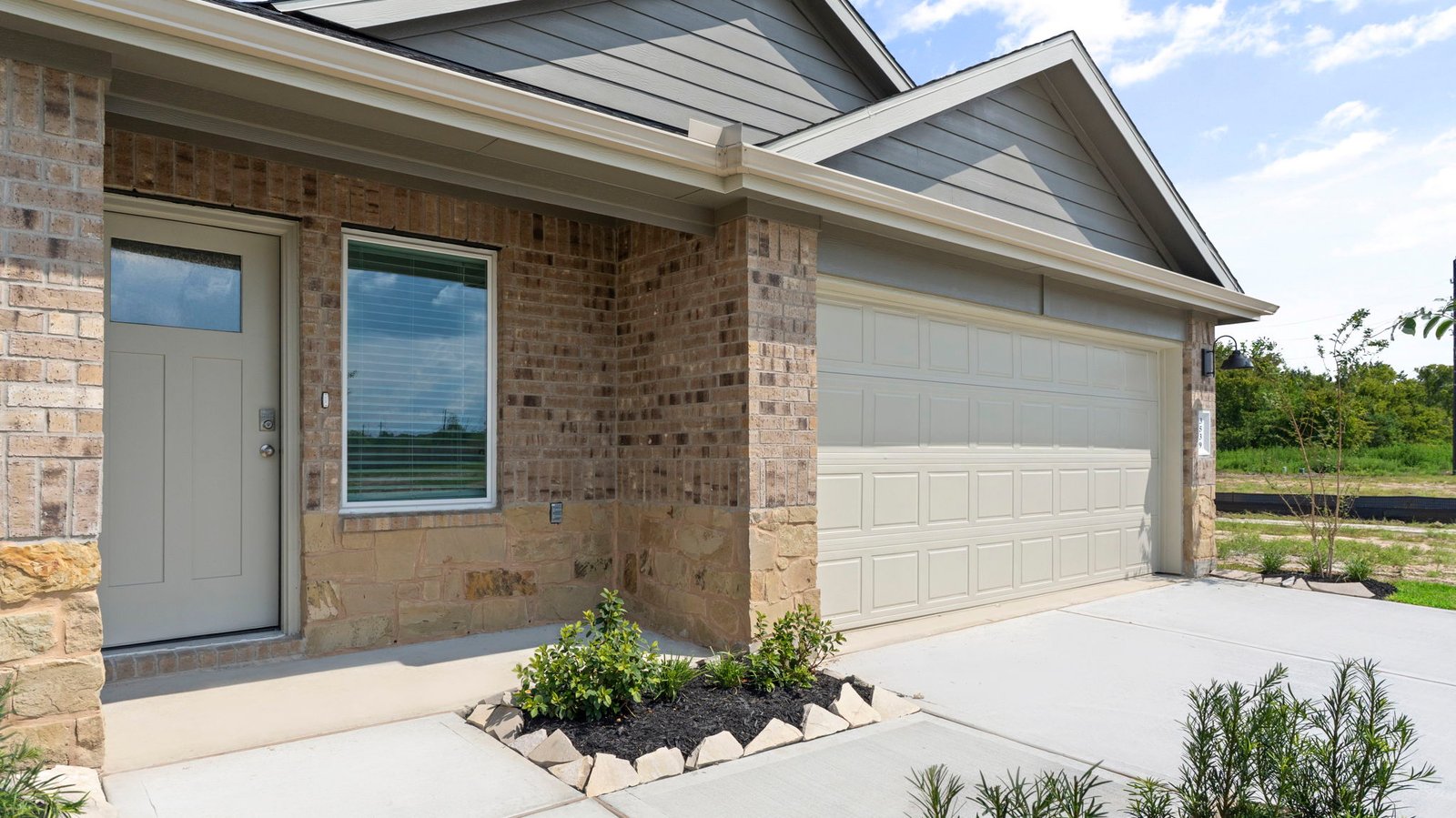 View of the front door entry and the garage