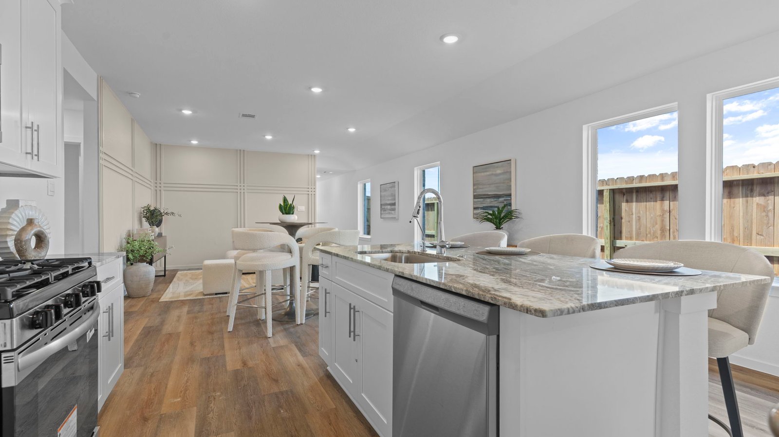 open concept kitchen with large island and walk in pantry