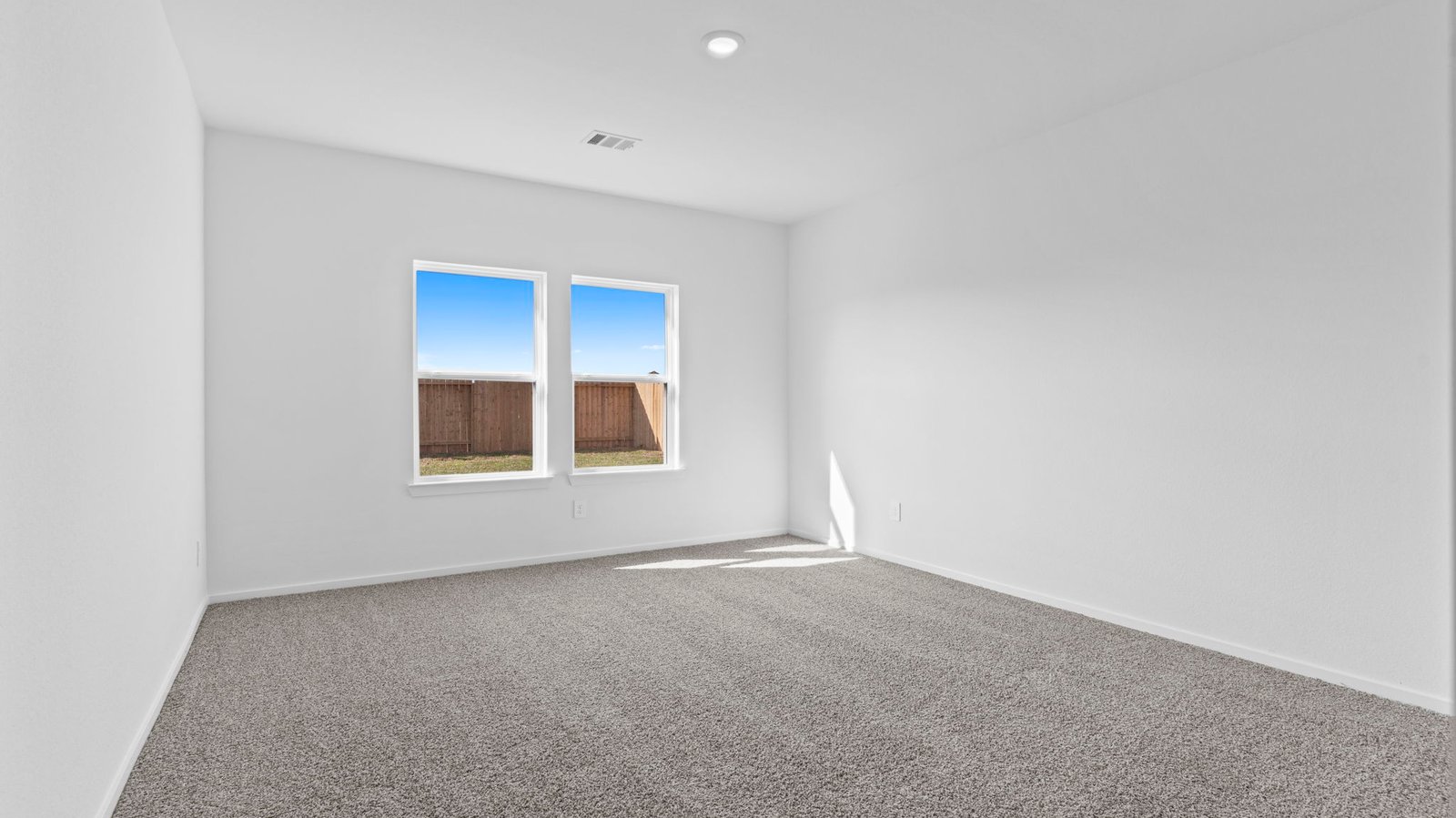 primary bedroom with large window