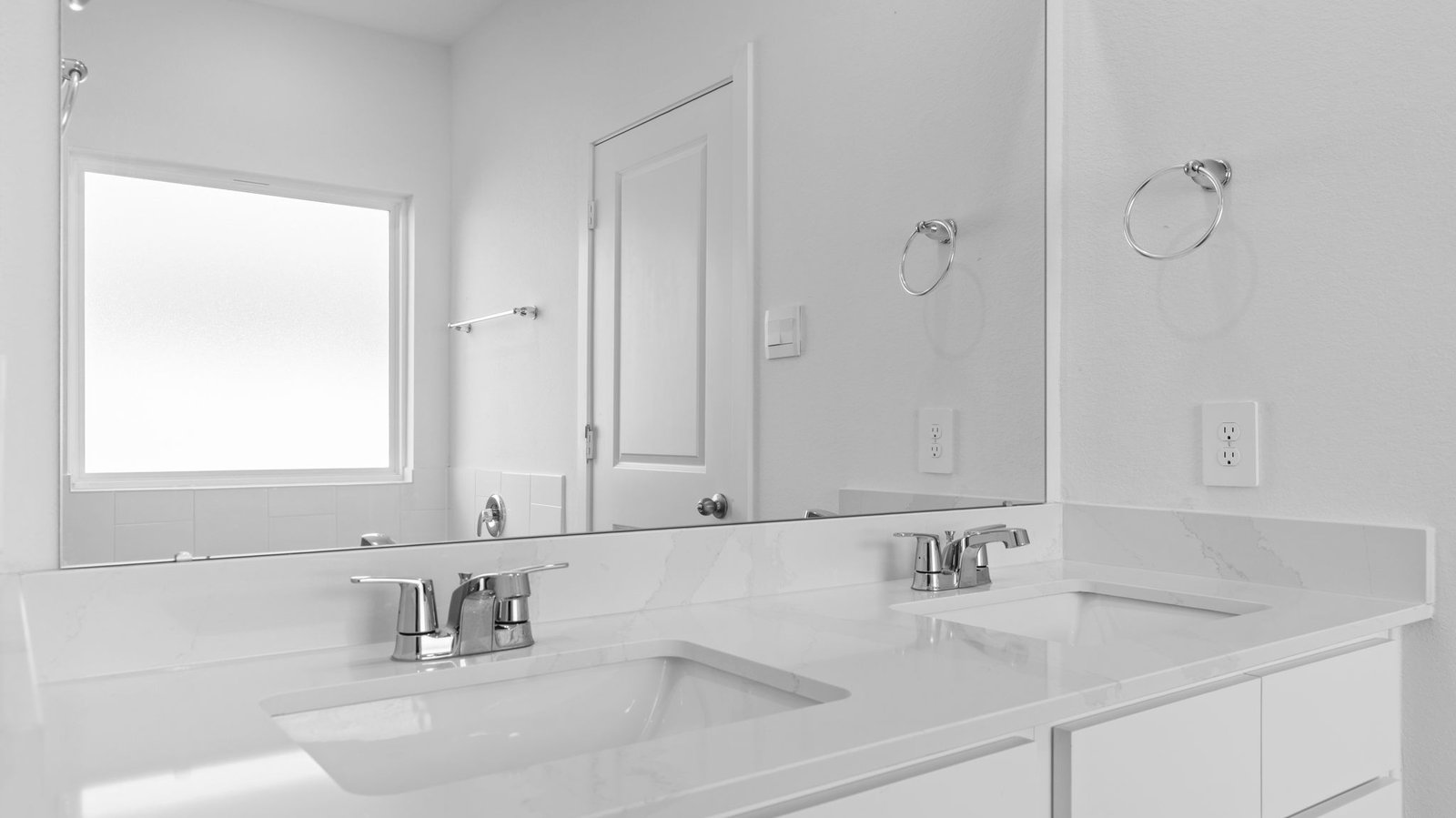 primary bathroom vanity with two sinks