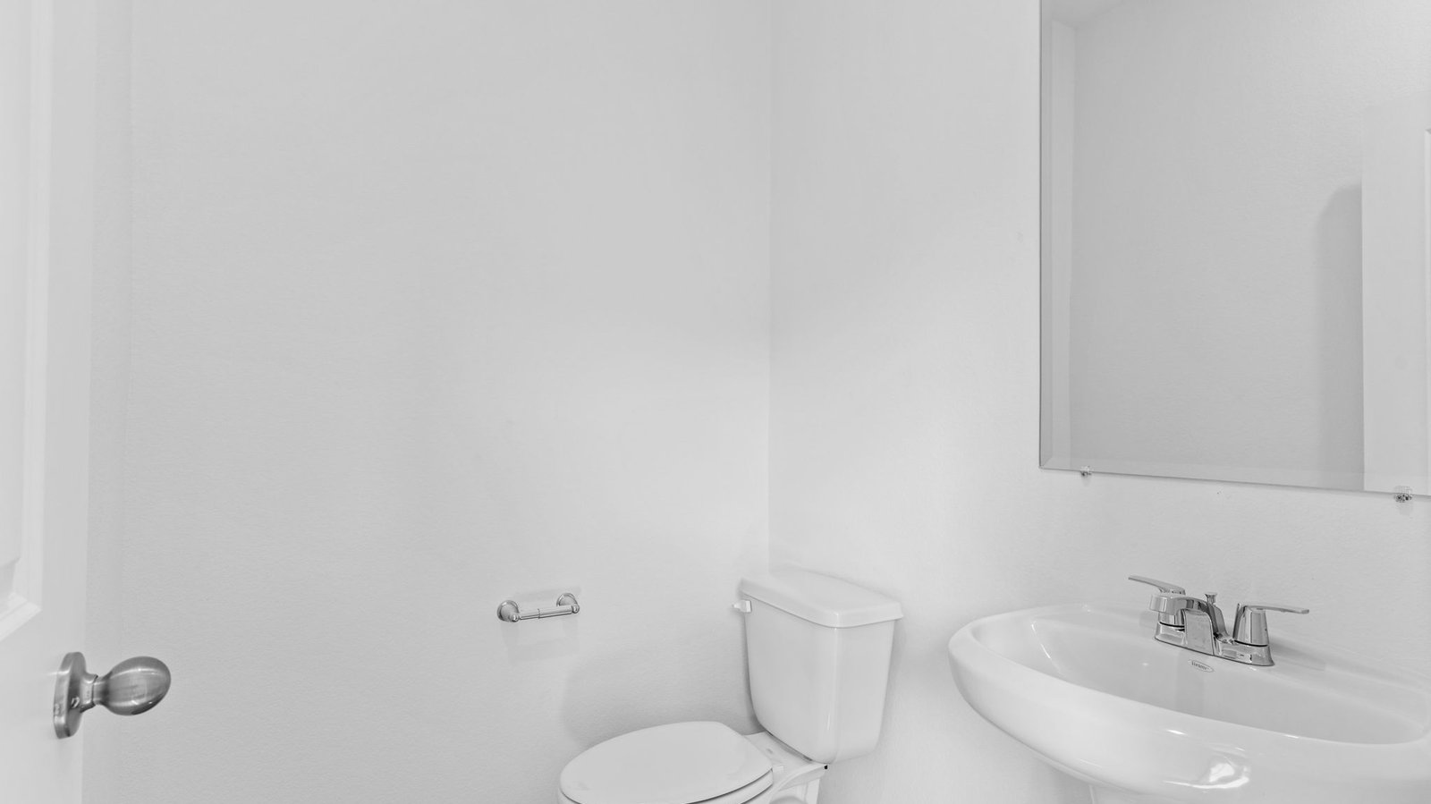 A decorated half bathroom downstairs for guests