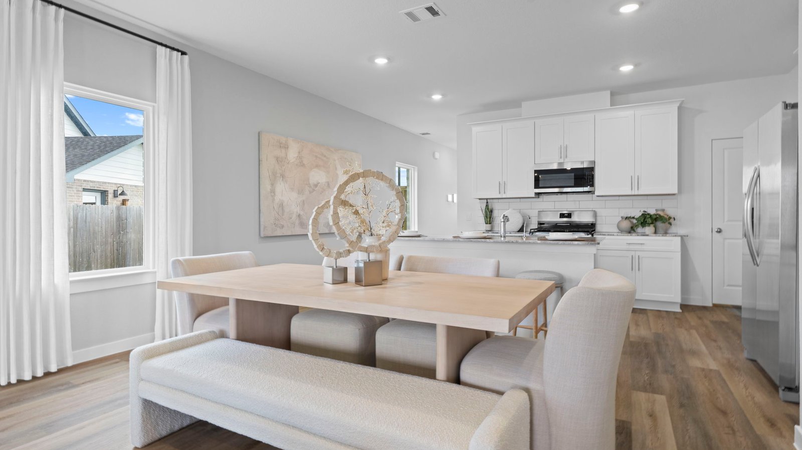 An open concept dining area with a large window