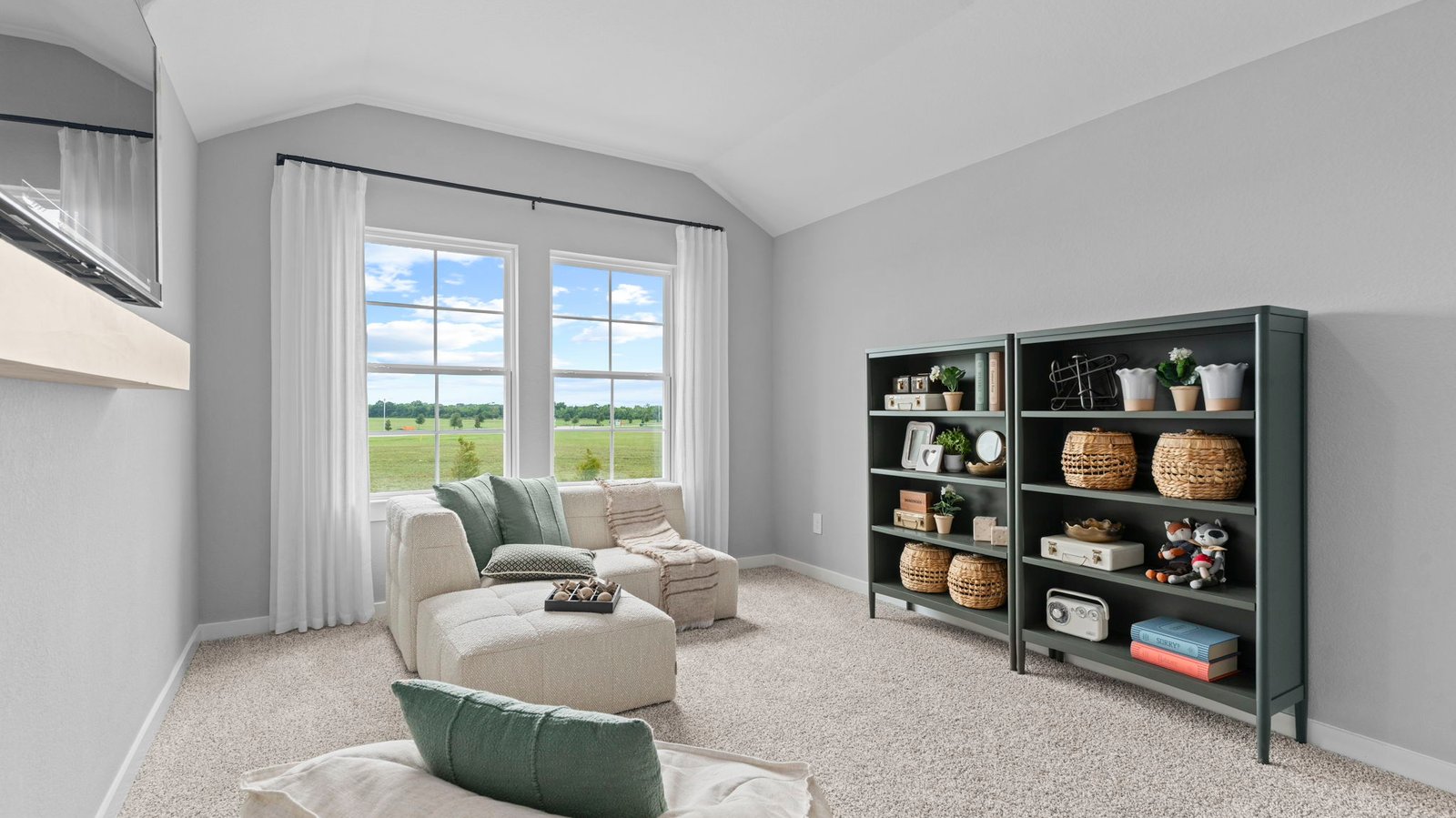 A game room upstairs with two large windows
