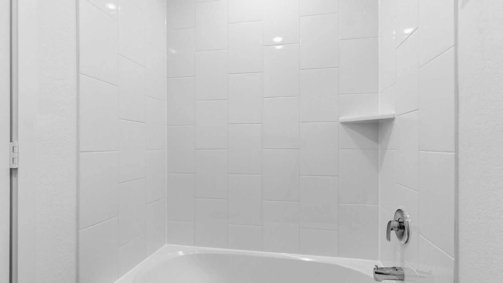 secondary bathroom with bathtub and shower combo