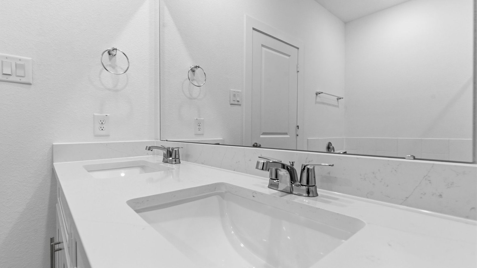 primary bathroom vanity with two sinks