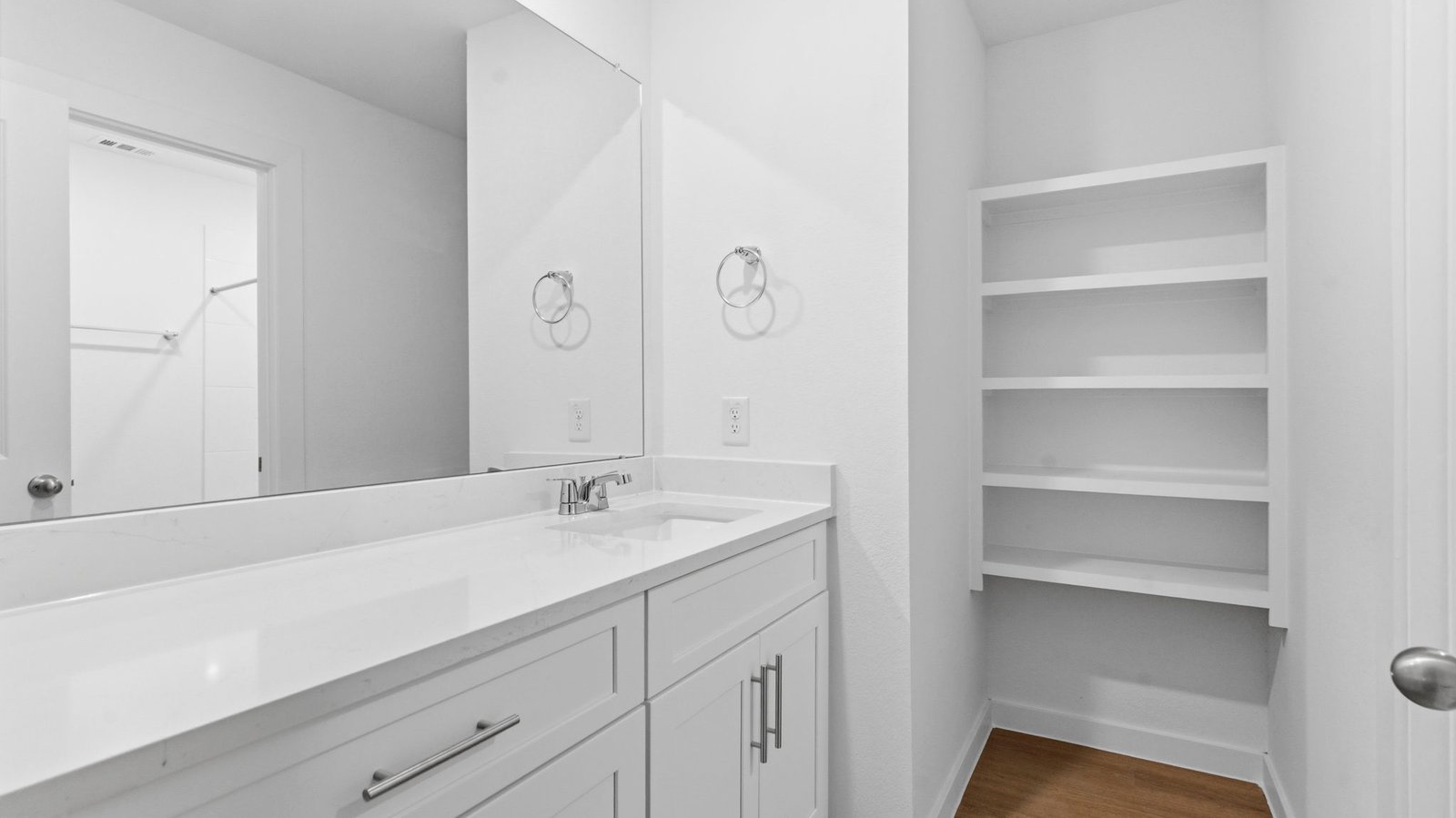 secondary full bathroom with two sinks