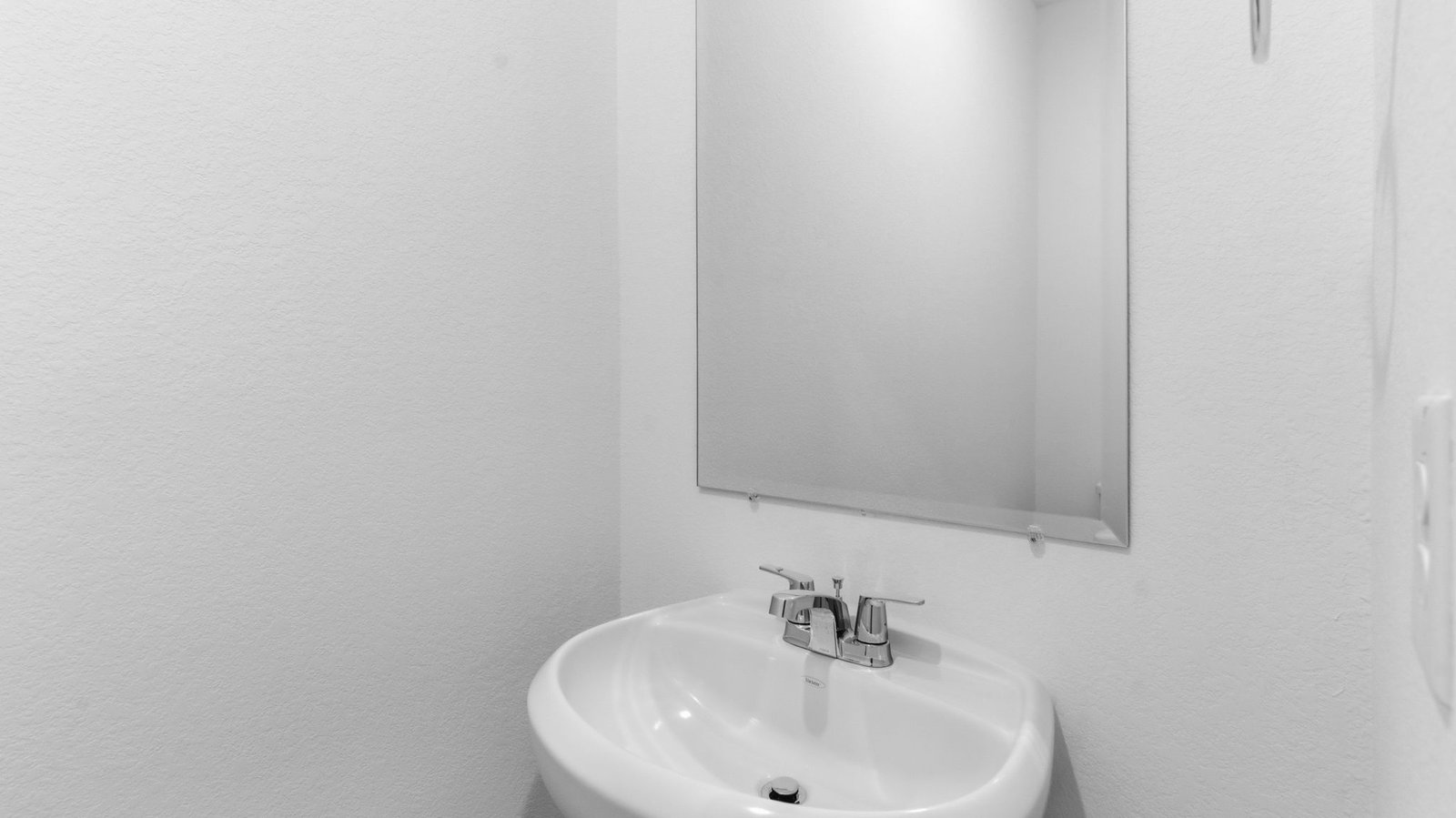 A decorated half bathroom downstairs for guests