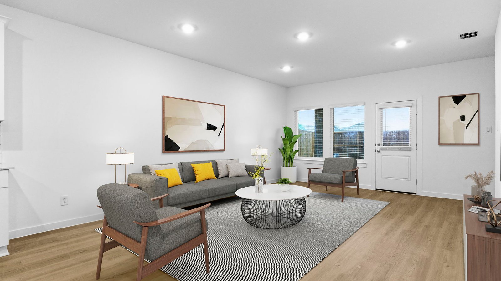 A cozy living room featuring a comfortable couch, a stylish coffee table, and an elegant painting on the wall.