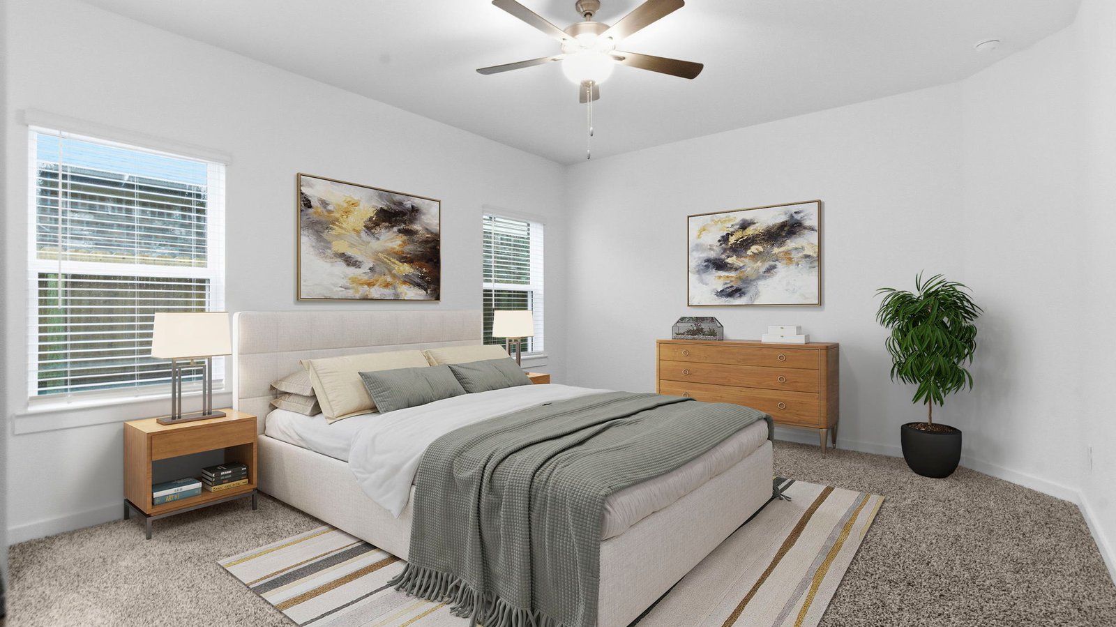 A spacious primary bedroom emphasizing open space and natural lighting with large windows.