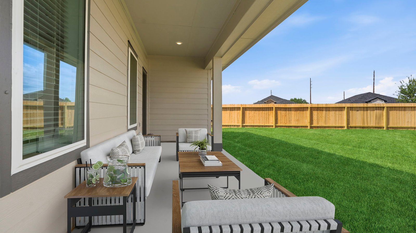 Outdoor covered patio with room for outdoor furniture to enjoy the backyard in those cooler months