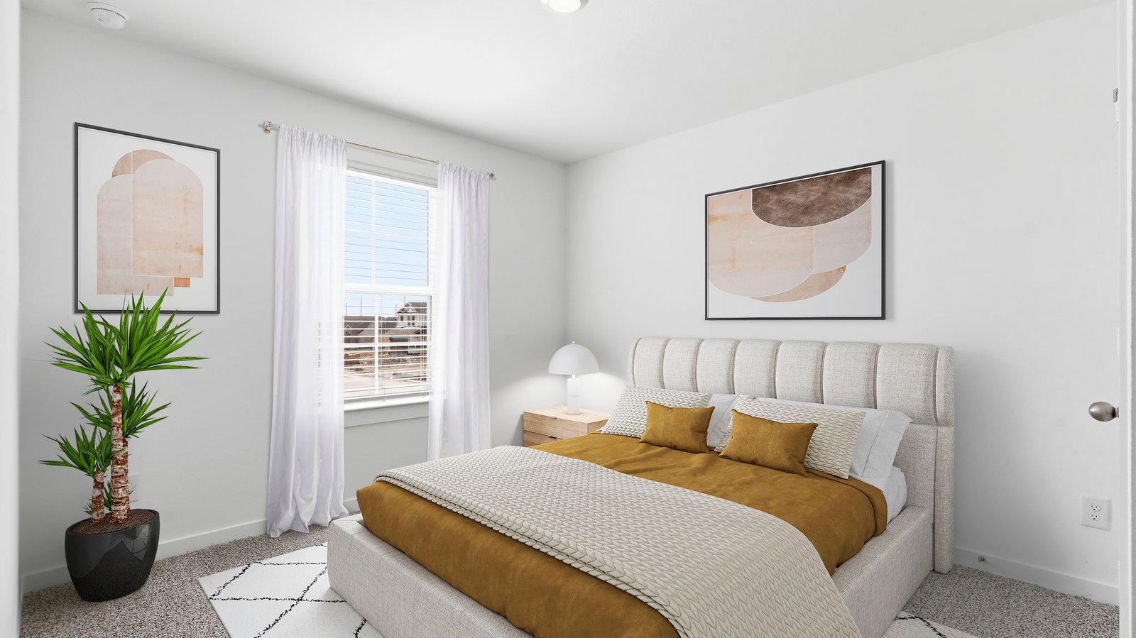 Comfortable guest bedroom featuring neutral-toned walls, carpeted flooring, and a separate closet.