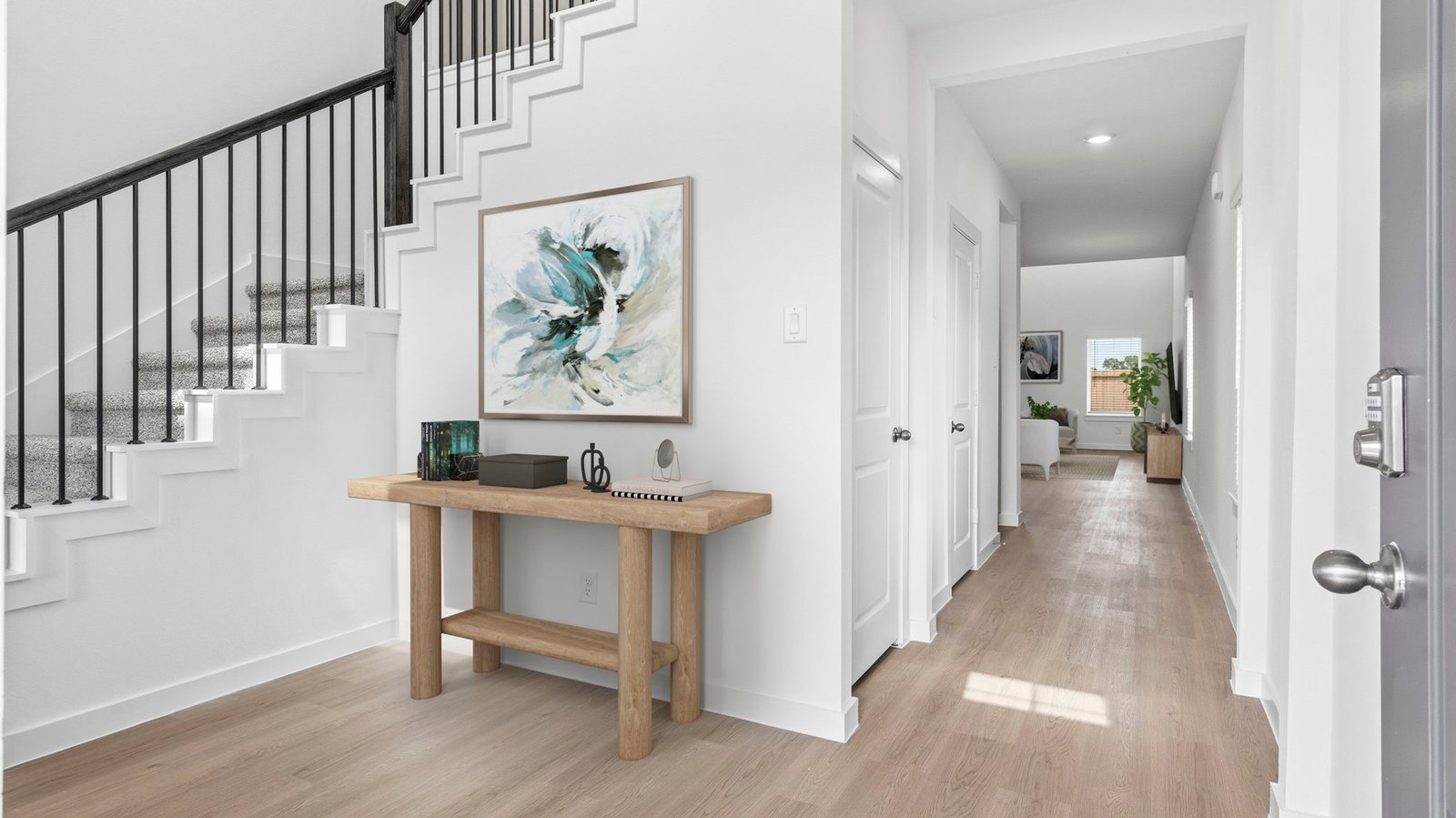 Spacious entry foyer with grand staircase leading to the second floor