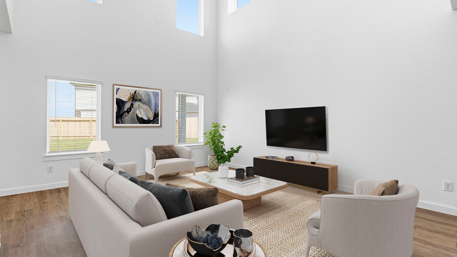 A well-organized living room that includes a kitchen and dining area, creating a warm and welcoming environment for gatherings.