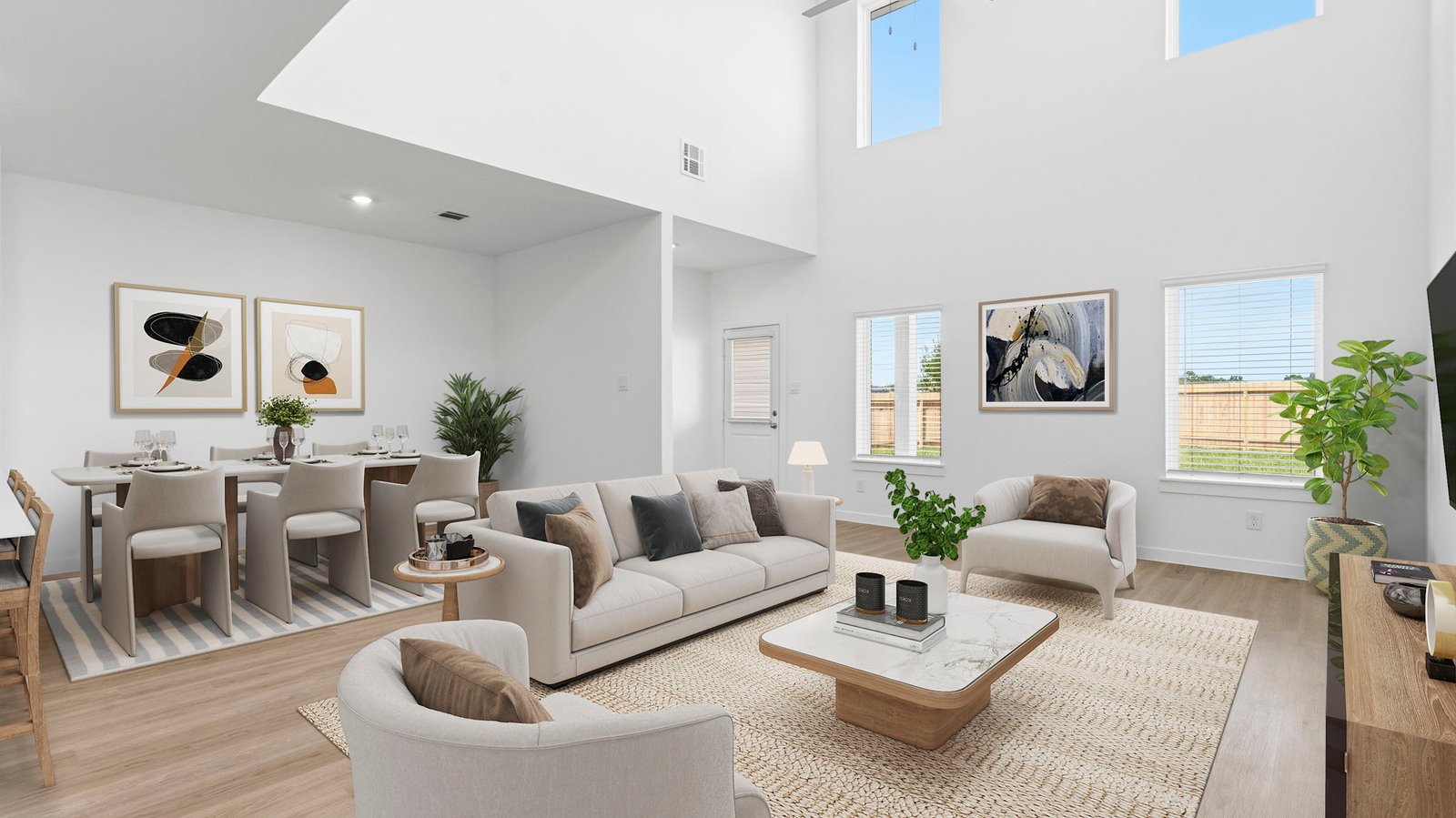 A well-organized living room that includes a kitchen and dining area, creating a warm and welcoming environment for gatherings.