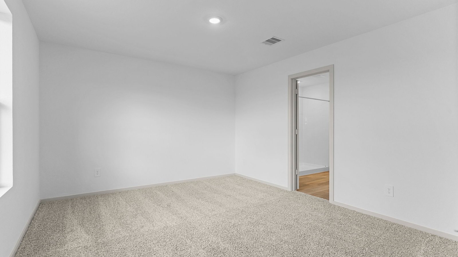 primary bedroom with two windows