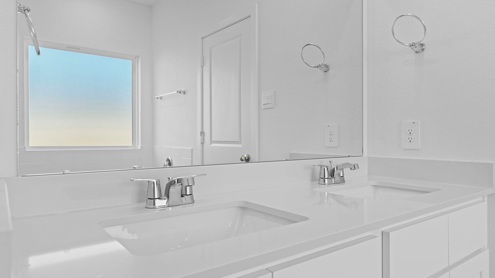 primary bathroom vanity with two sinks