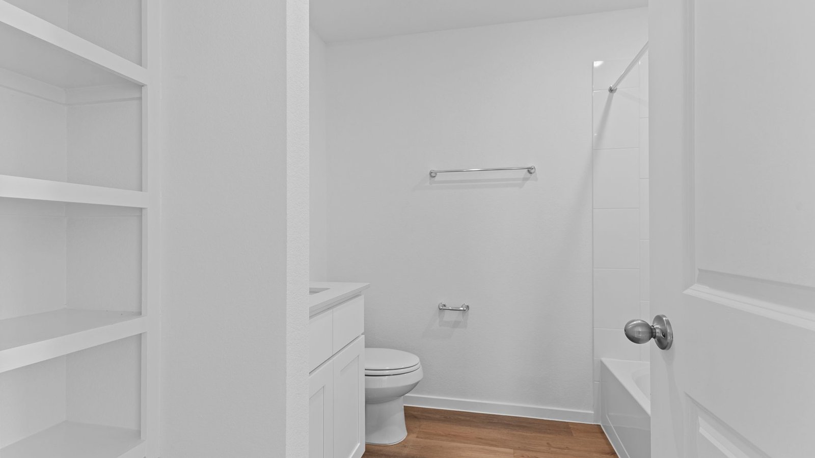 secondary bathroom with one sink and open shelving